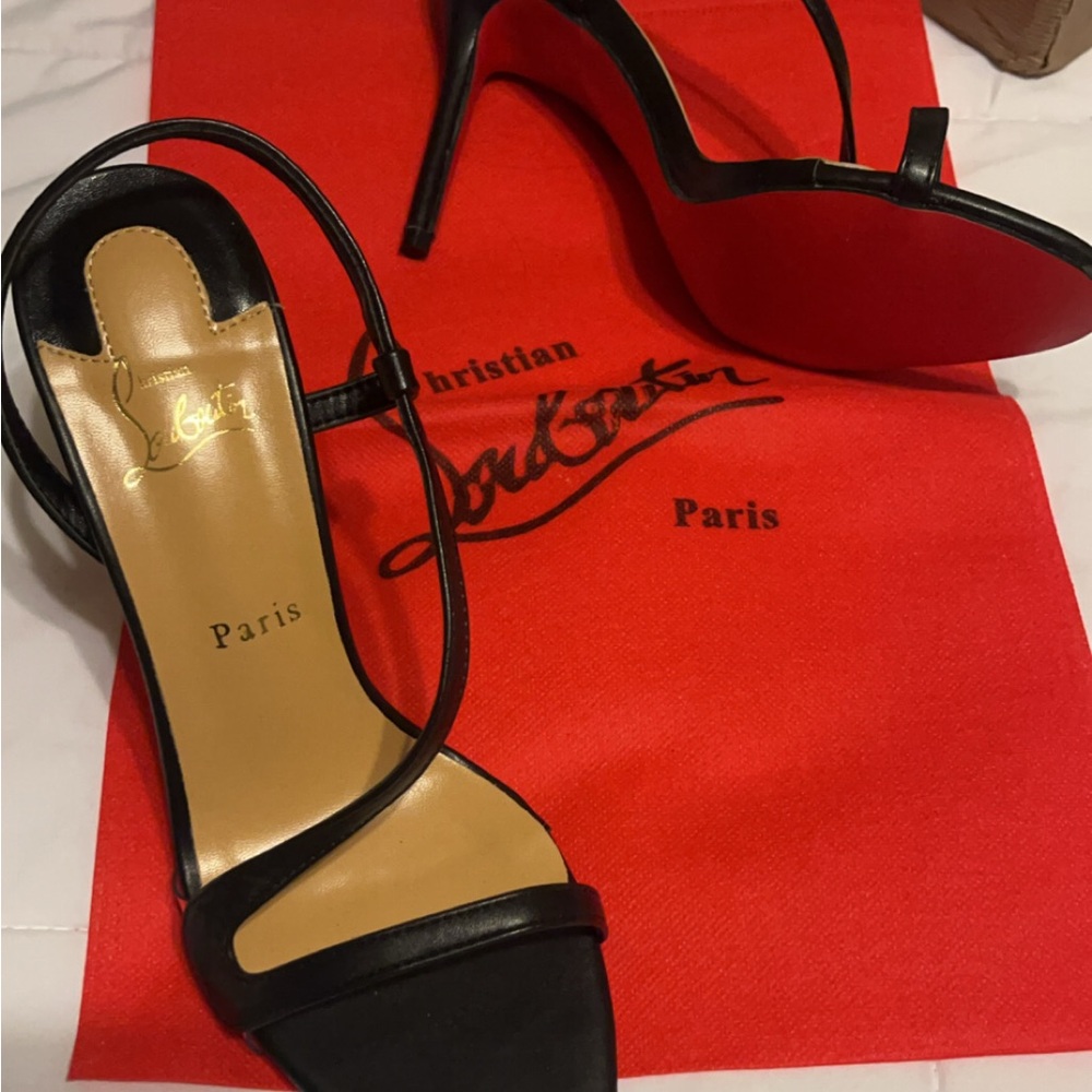 Black single strap red bottom heels